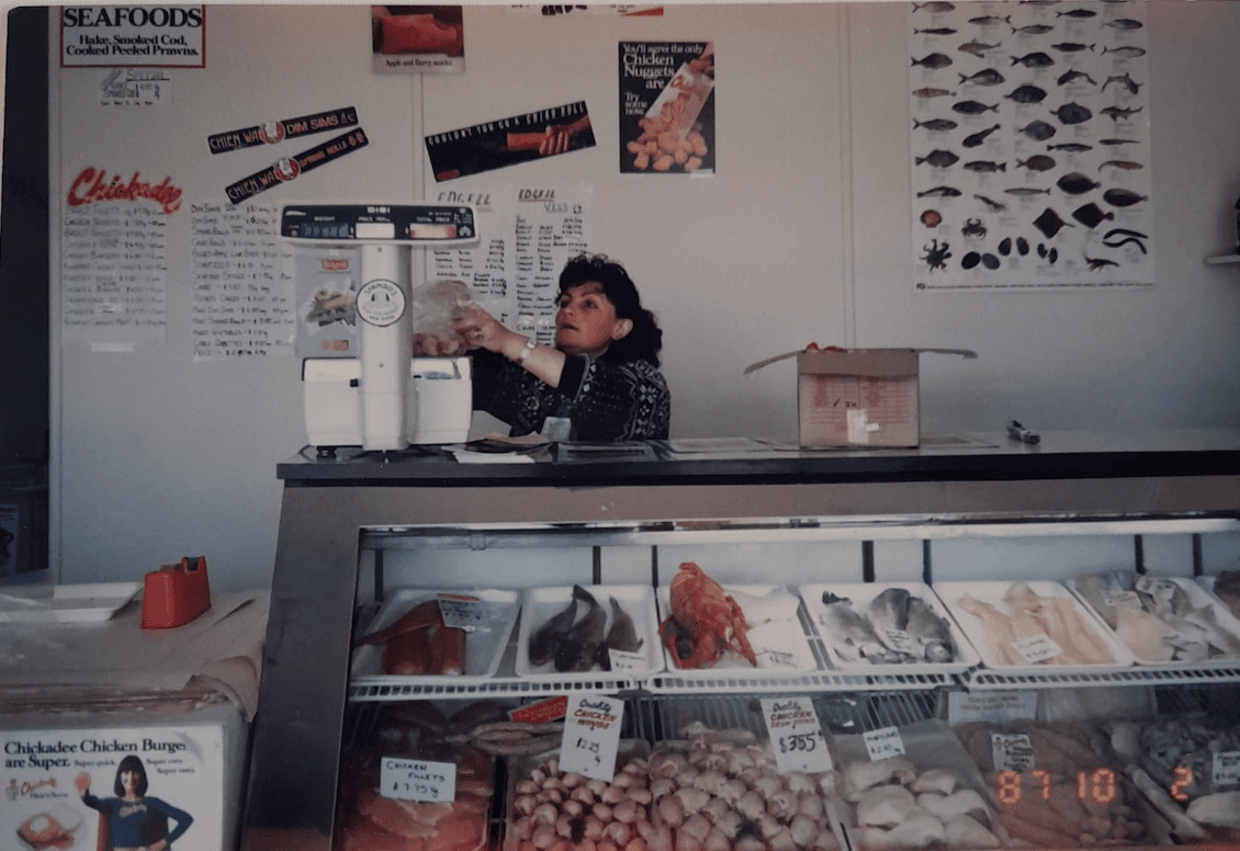 Olga Athanasopoulous working behind the seafood counter in Stambo's first retail shop